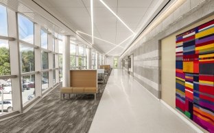 A window-lined walkway inside the VA Ambulatory Hospital.