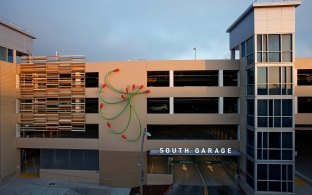 Exterior of the garage with a sign reading "South Garage"