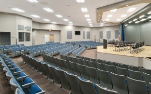 Several rows of seating in a small auditorium.