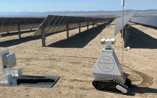 The OnSight Technology robot in front of solar panels