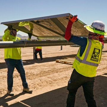 construction workers working on a solar job site