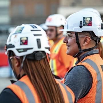 People at meeting on jobsite.