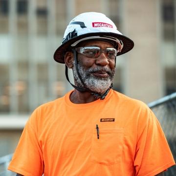 Construction worker smiling.