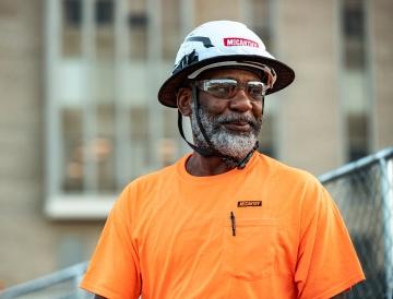 Construction worker smiling.