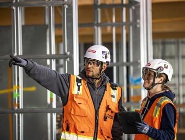 employees inside building looking at something