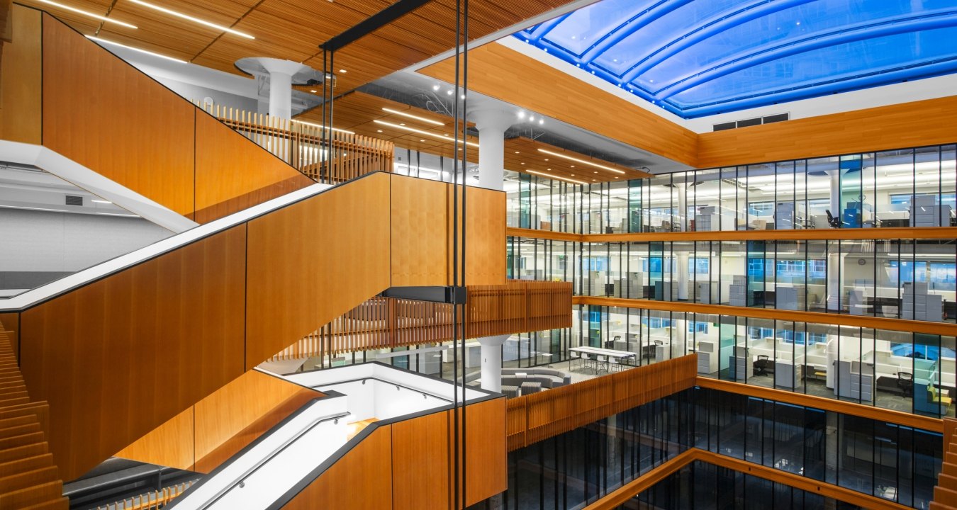 Staircase overlooking several floors of offices. 