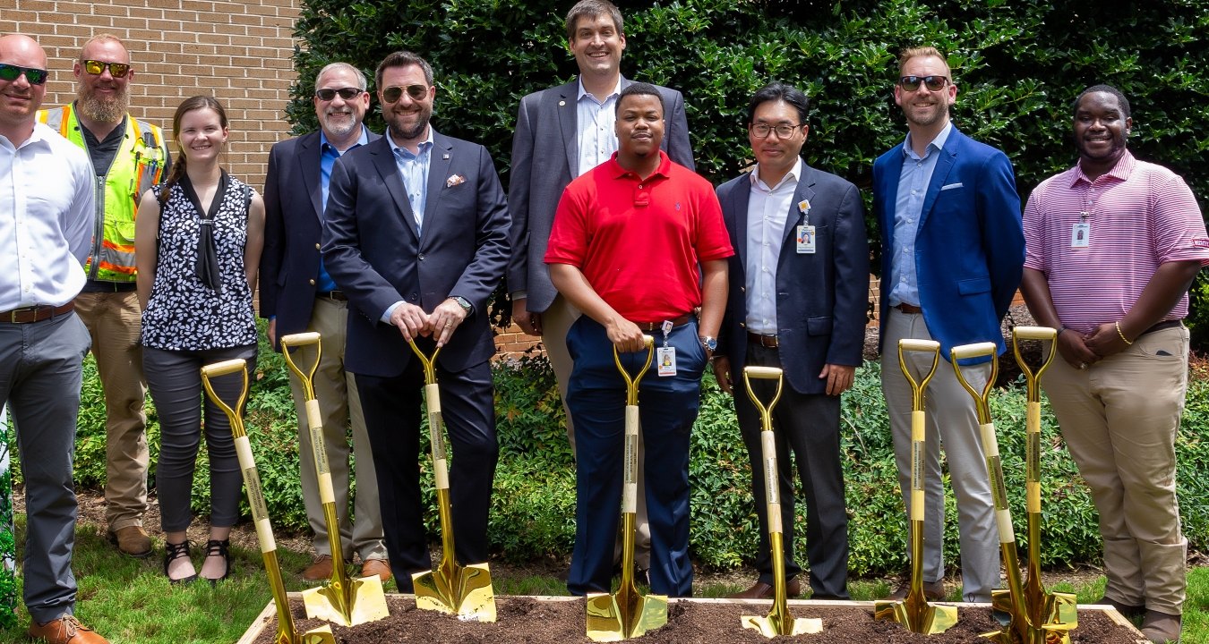 People with shovels at groundbreaking event