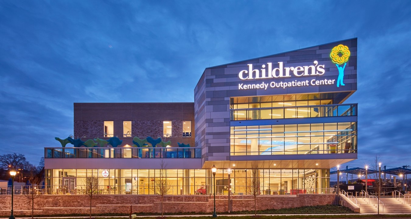 A brilliant exterior view of the Children's Hospital Outpatient Center at dusk.