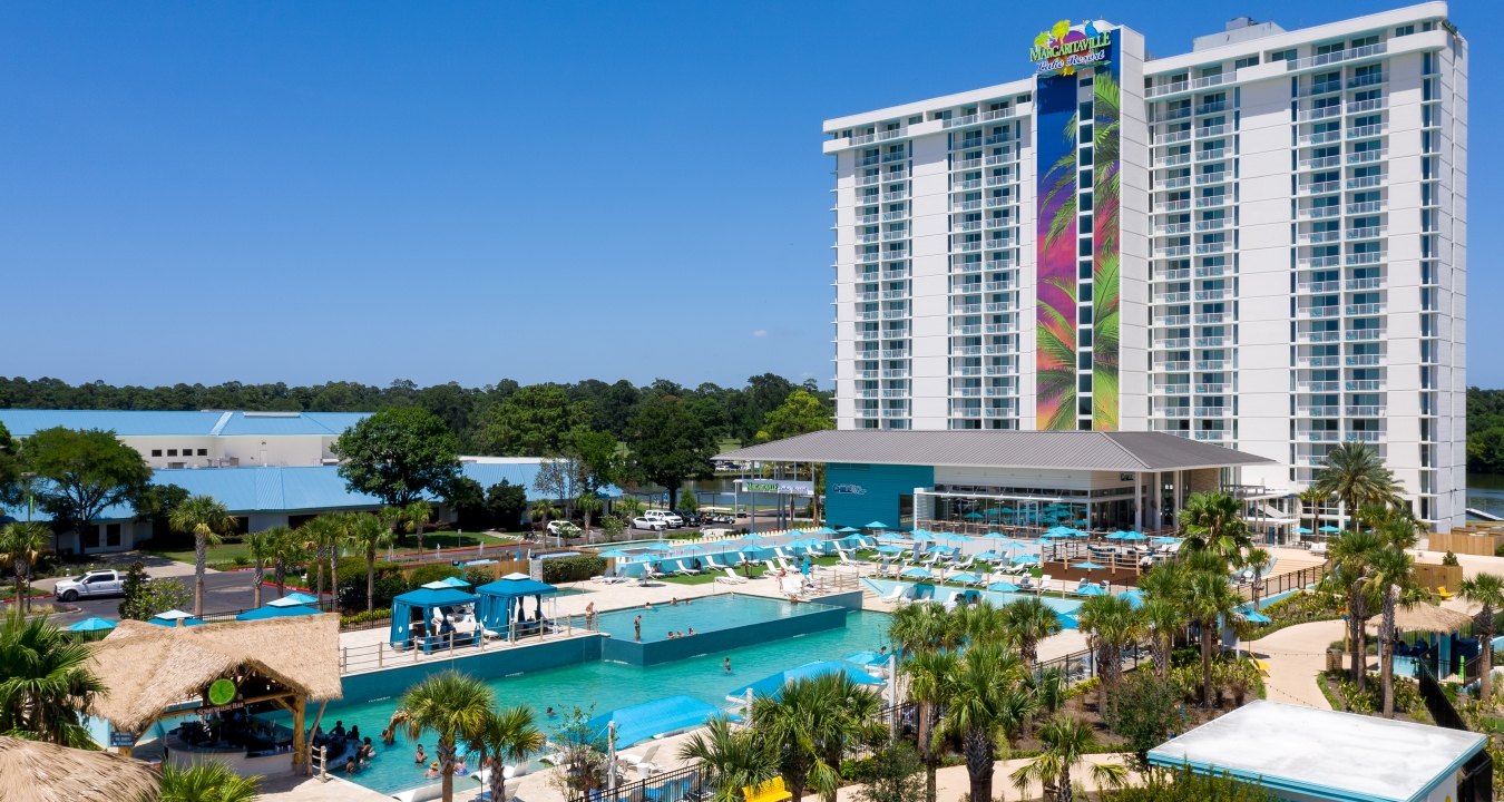 Exterior view of the resort tower with the pool in the foreground 