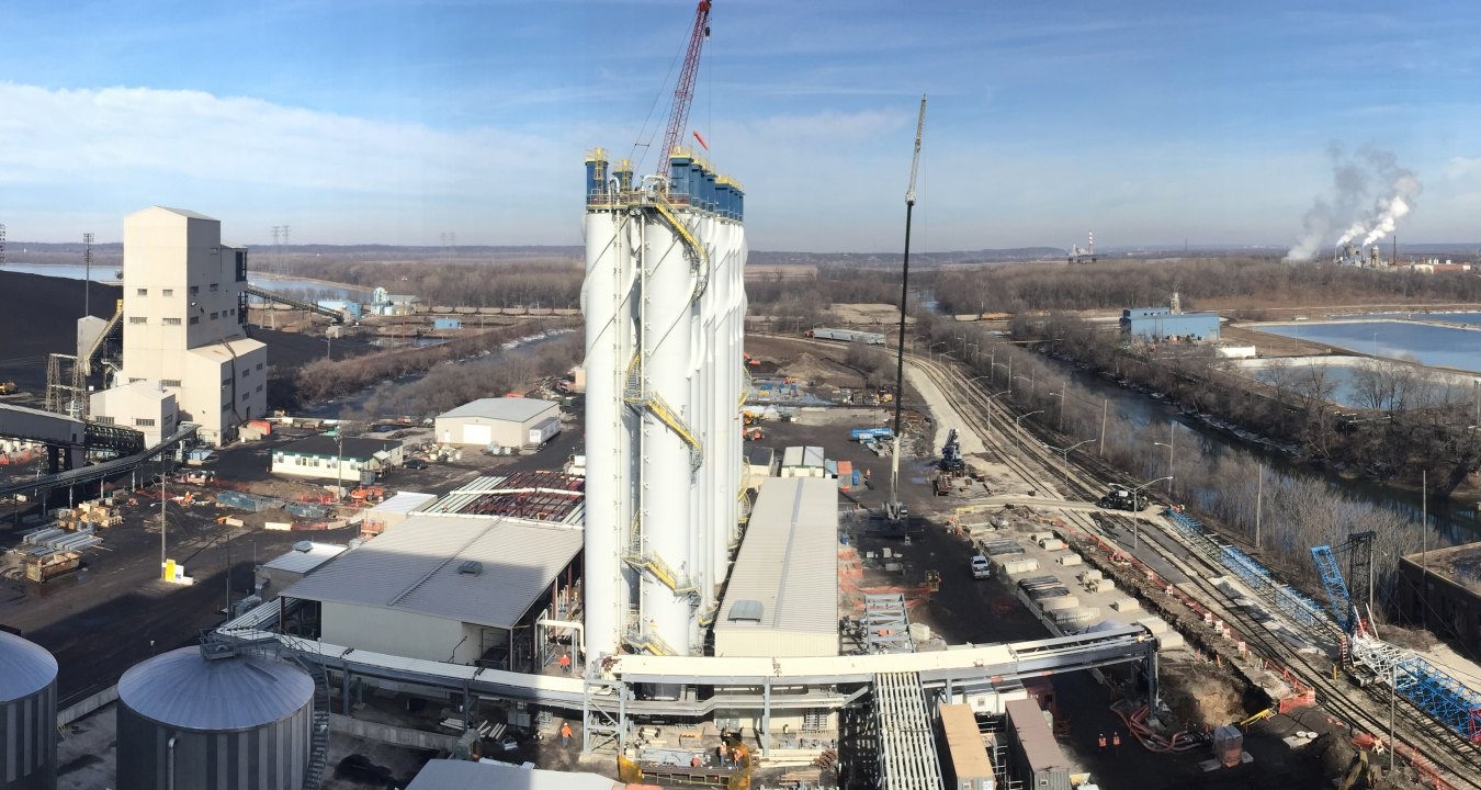 Wide angle outdoor image of the buildings and piping