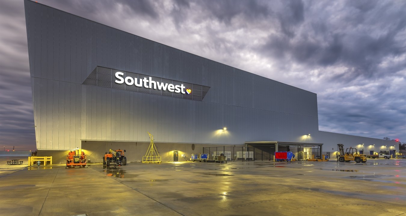 Exterior view of the hangar at nighttime with Southwest sign