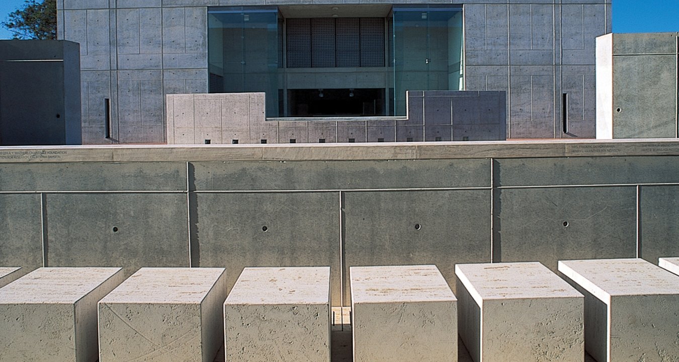 Outdoor entrance to the building that is all concrete