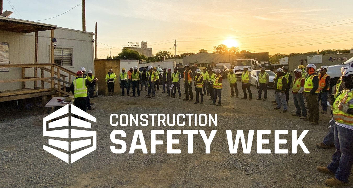 Team of construction workers celebrating Construction Safety Week.