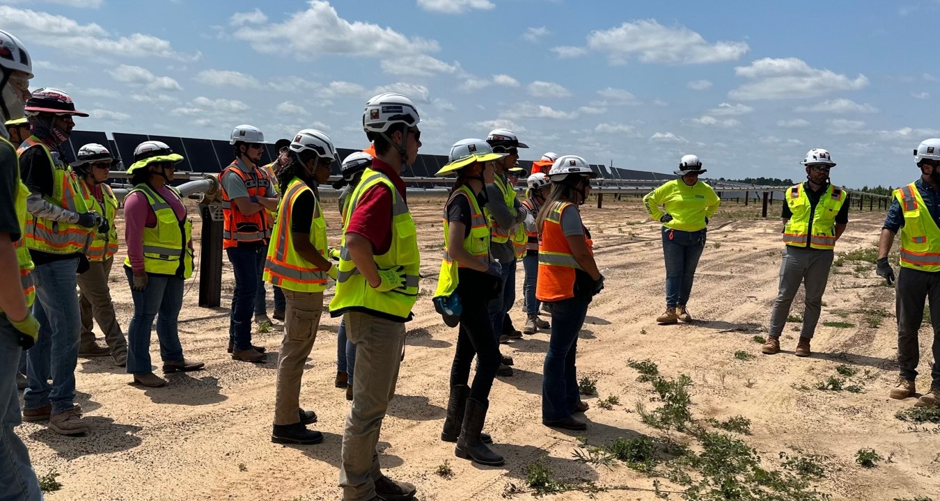 A group of interns on a renewable energy jobsite tour