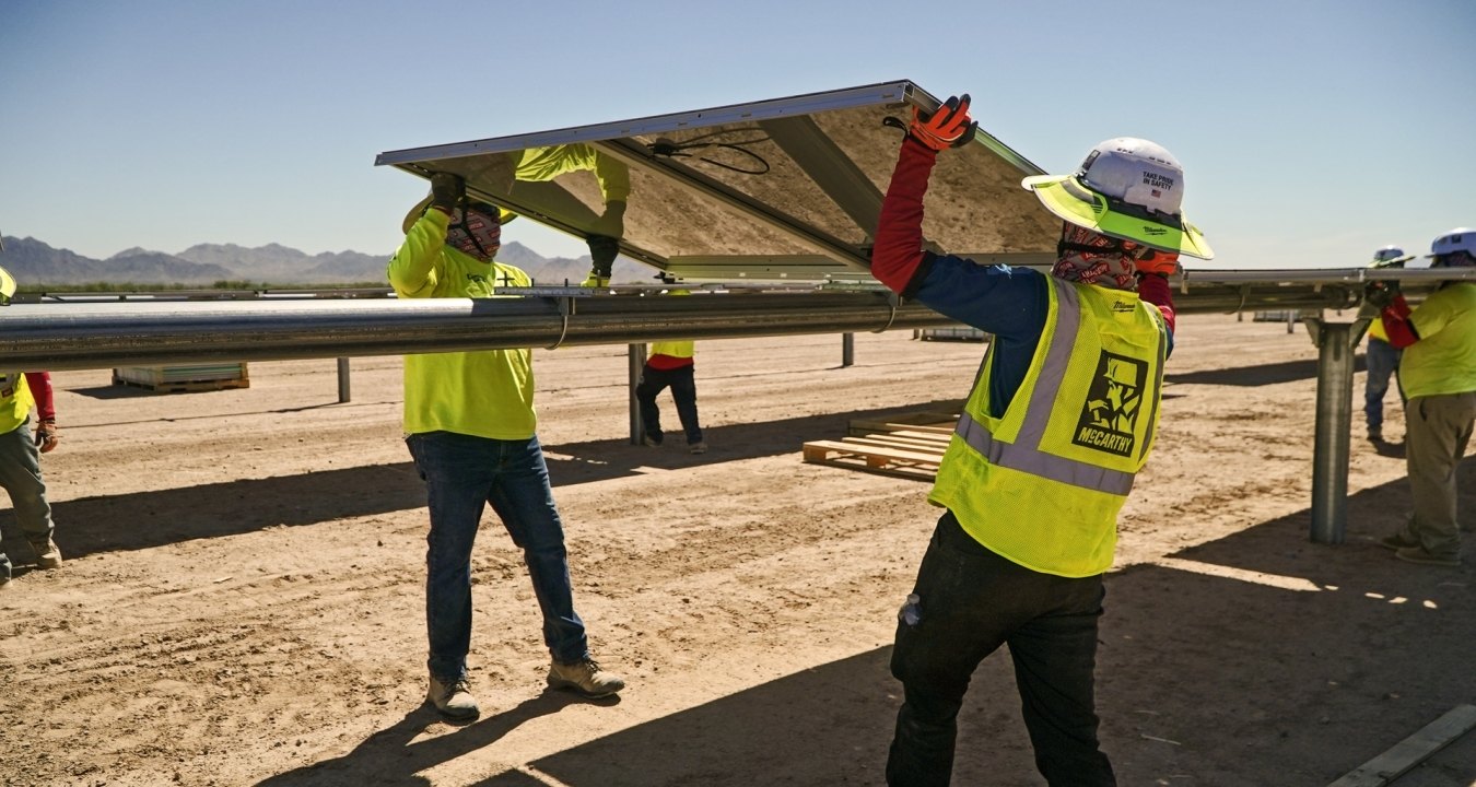 construction workers working on a solar job site