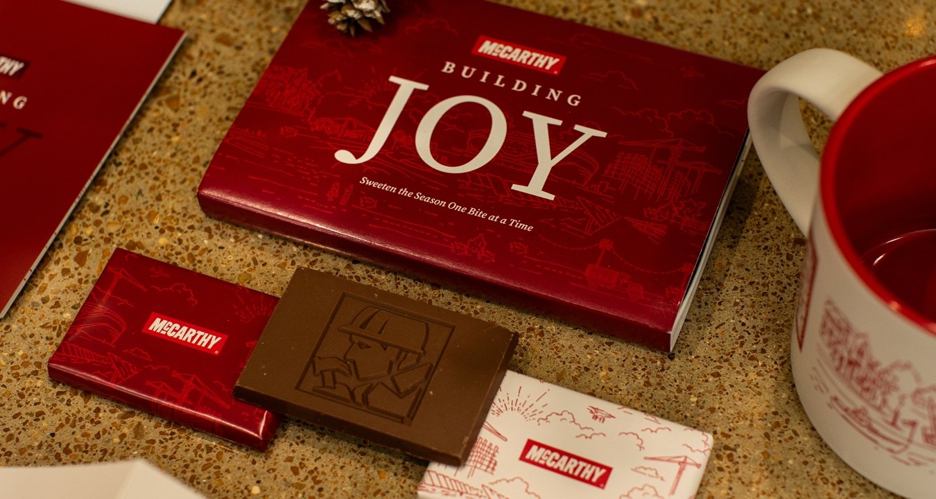 A spread of McCarthy branded holiday goods likes cards and chocolate
