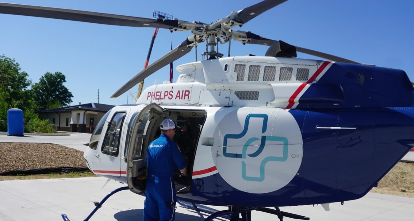 A person looking inside a helicopter