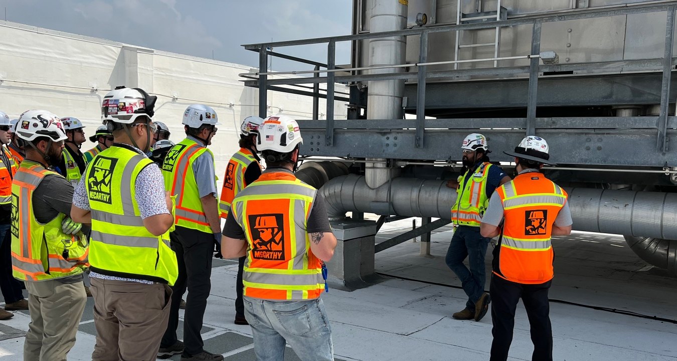 A group of people wearing PPE on a jobsite.