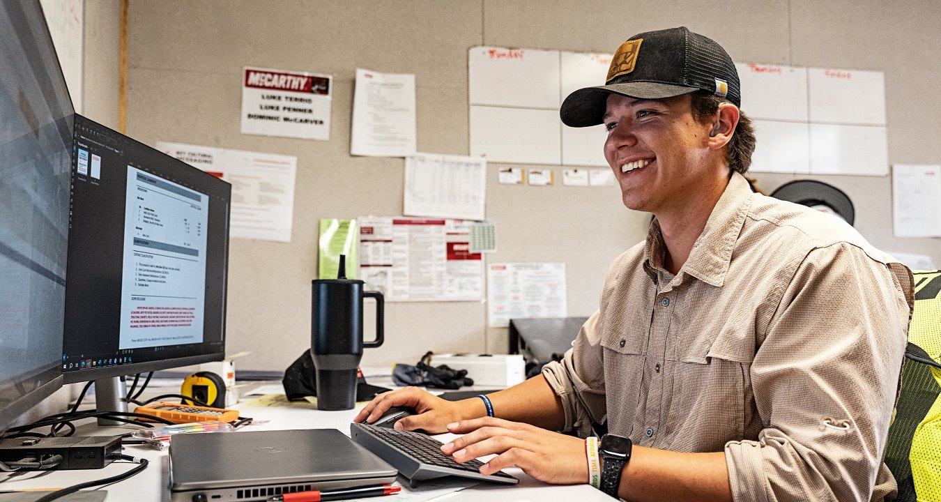 A person looking at a computer screen