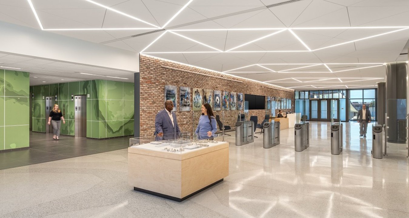 A lobby area with a desk in the middle