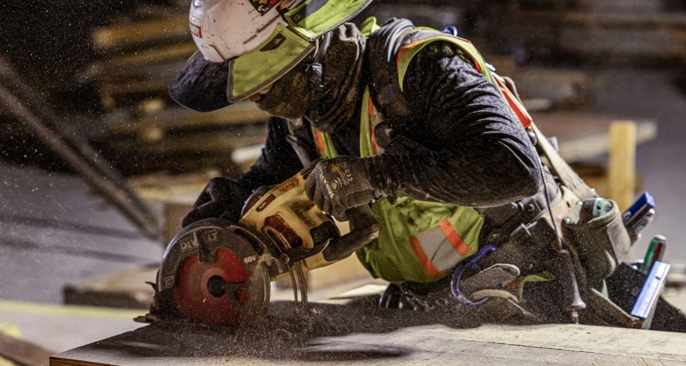 A person using a circular saw