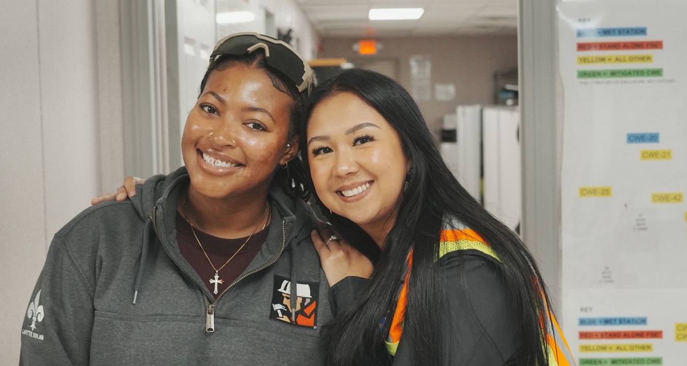 Two people smiling and posing for a photo