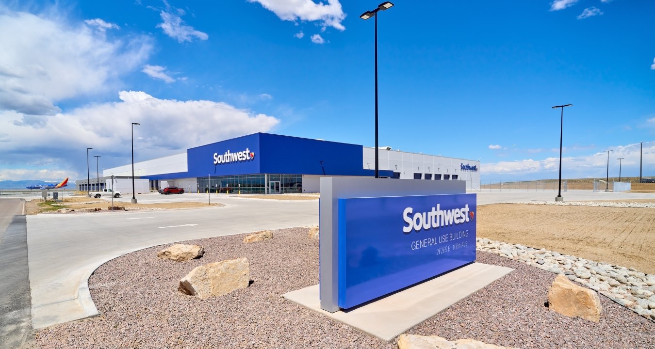 Image of the exterior of the building and a Southwest Airlines sign in the foreground.