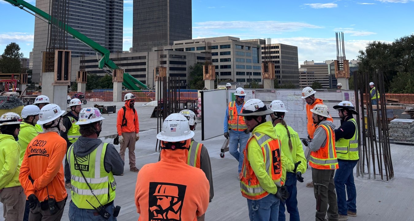 A group of people standing together on a jobsite 