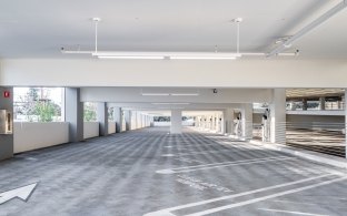 Parking spaces inside the parking garage during the daytime.