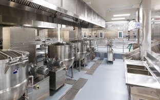 Inside Area at Housing and Healthcare Facility Stockton with Stainless Steel Machines and Sinks