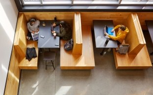 Aerial view of people sitting at a booth