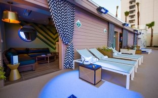 Covered cabana areas and pool lounge chairs