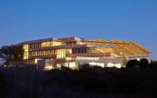 Brilliant exterior shot of the J. Craig Venter Genome facility at dusk.