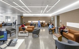 A waiting area with chairs and couches.