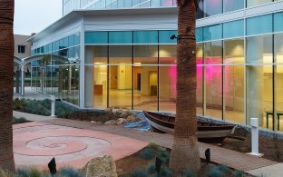 Rady Children's Hospital & Health Center exterior with play boat in garden bed