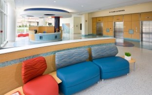 Patient waiting area seating and lobby near elevators