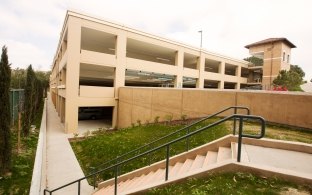 An external view of the Soka University of America parking structure from grade level.