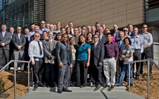 A large group of people standing outside a building.