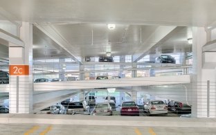 UC Davis Parking Structure interior with parked cars