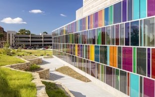 The stained glass windows of the VA Ambulatory Hospital viewed outside.