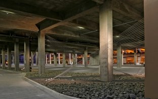 Interior view of the parking garage with empty parking spaces.