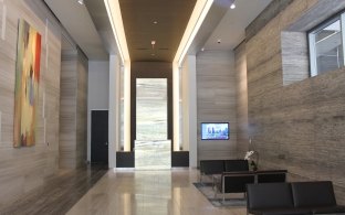 A hallway with couches and lounge area