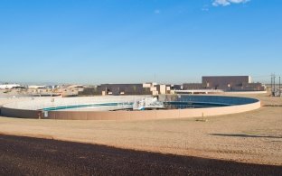 A large water treatment holding pond with white edges.