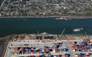Aerial view of the container terminal with ships moving down the waterway