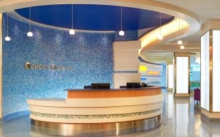 A front desk area with blue wall in the background