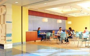 People sitting at tables in a dining area