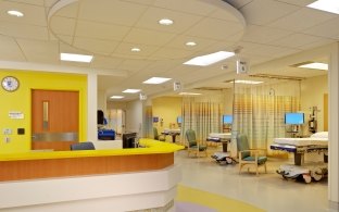 Patient areas with curtains in between each bed. 