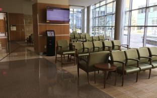 A waiting area with a few rows of chairs