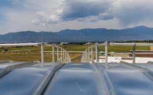 Colorado Springs Utilities Southern Delivery System Water Storage Tank Rooftop with Mountains in Distance.