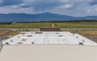 Colorado Springs Utilities Southern Delivery System Rooftop. Mountains in Distance.